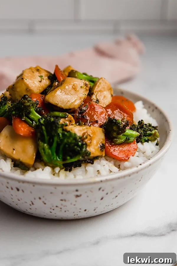 Close-up view of the finished Honey Garlic Chicken Stir Fry in a serving bowl.