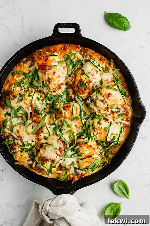 Skillet full of zucchini roll ups.