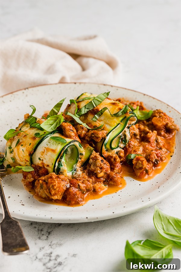 Zucchini roll ups on a plate.