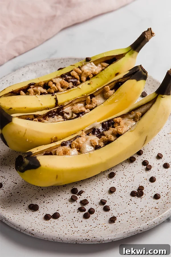 Campfire banana s'mores on a plate.