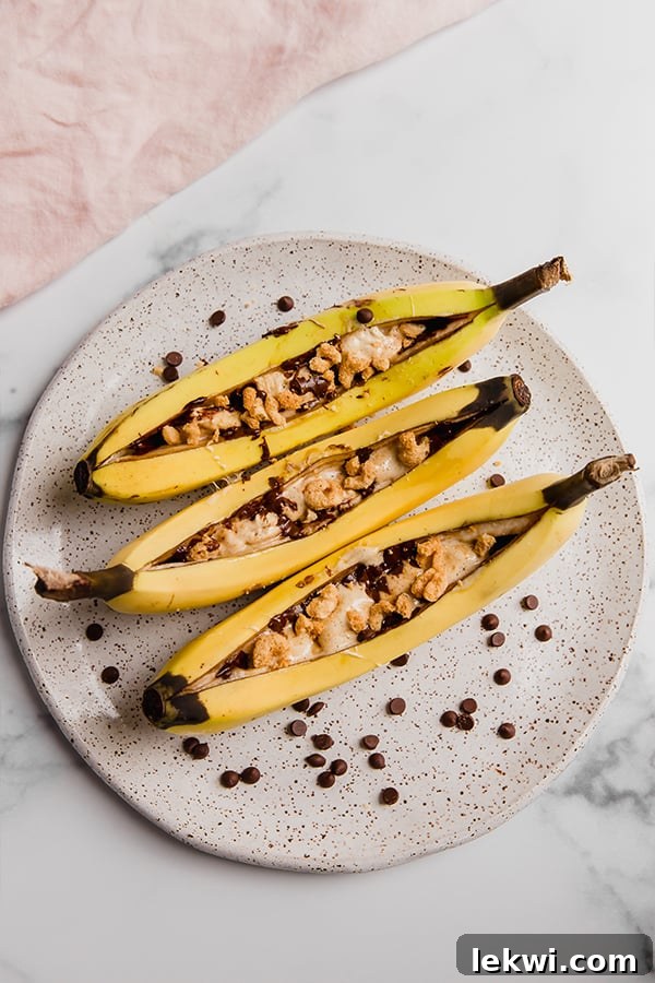 Three campfire bananas on a plate.