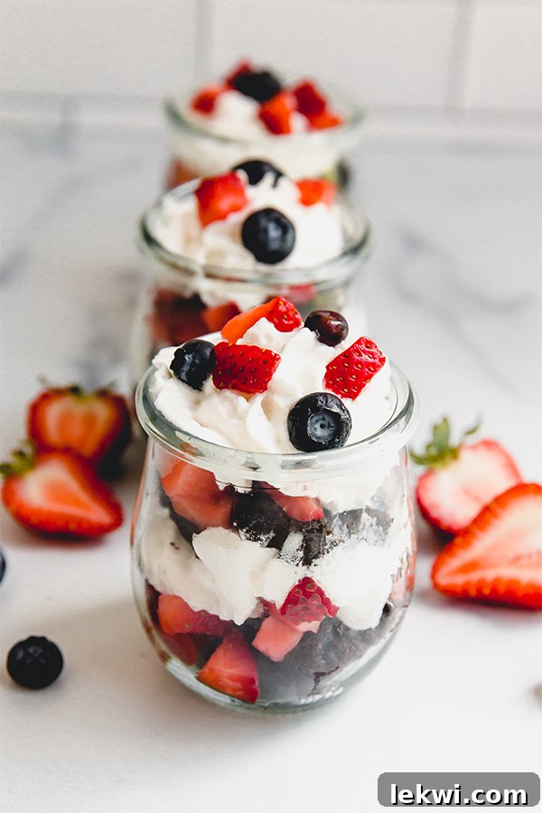 Glasses of brownie berry parfaits, beautifully layered and ready to be enjoyed.