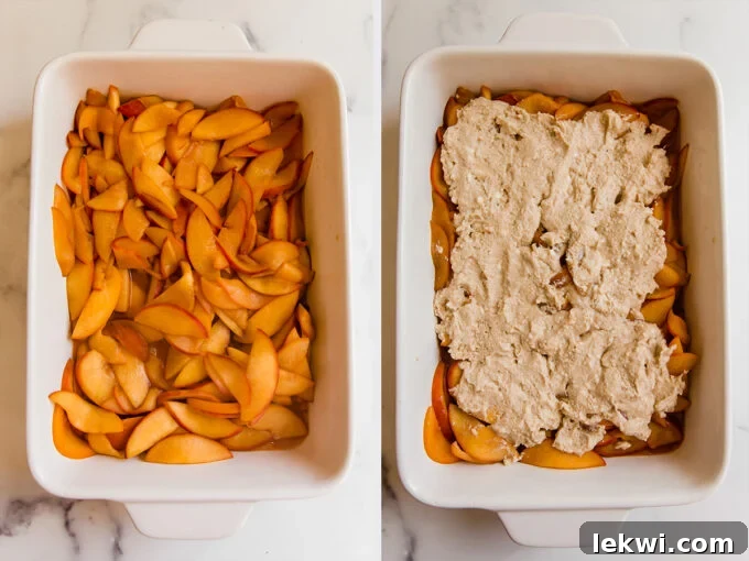 An uncooked Paleo & AIP Peach Cobbler in a baking dish, showing a layer of tender peach filling beneath a scattered topping of biscuit dough.