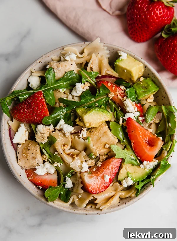 Strawberry balsamic pasta salad in a bowl.