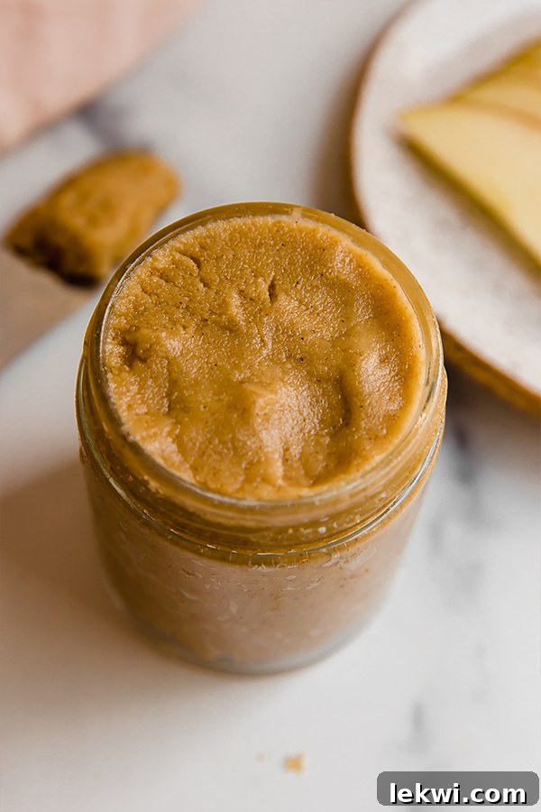 Creamy tigernut butter in a clear glass jar, perfectly smooth and ready to spread.
