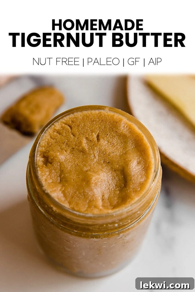 A glass jar with a label reading "Homemade Tigernut Butter Nut Free | Paleo | GF | AIP." This image emphasizes its dietary benefits and homemade quality.
