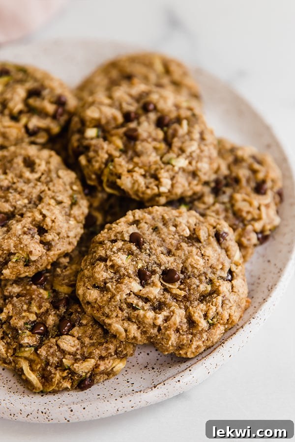 Plate of soft, chewy chocolate chip oatmeal zucchini cookies, perfectly baked and ready to enjoy.