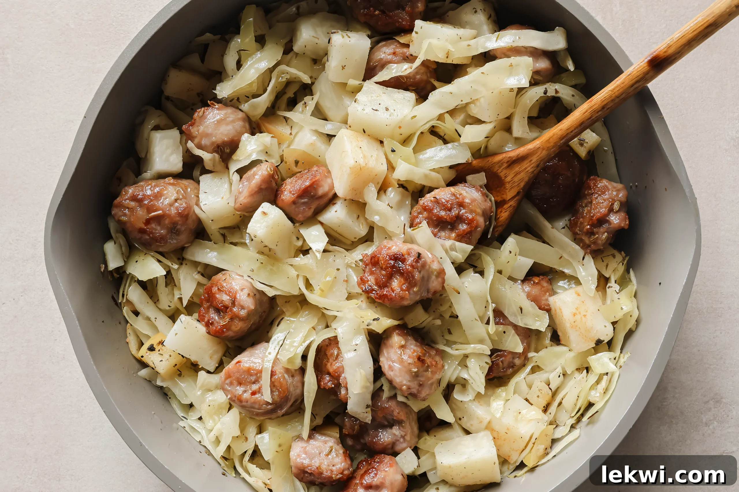 The fully combined Cabbage and Sausage Breakfast Skillet, showcasing tender cabbage, savory sausage, sweet potato, and apple, all harmoniously cooked in one pan.