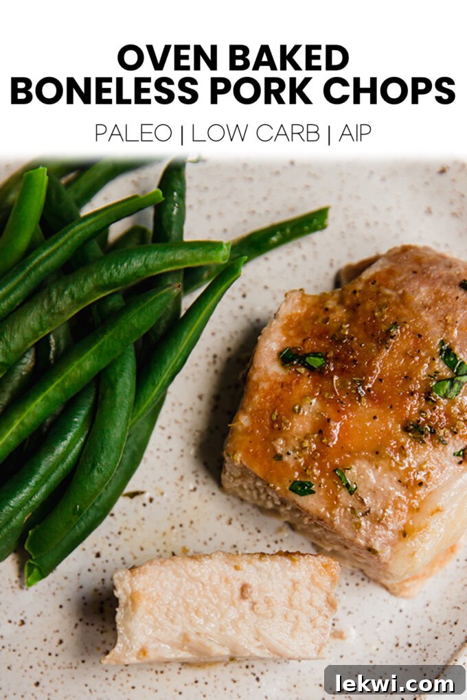 Plate of food with text \"Oven Baked Boneless Pork Chops Paleo | Low Carb | AIP.\"