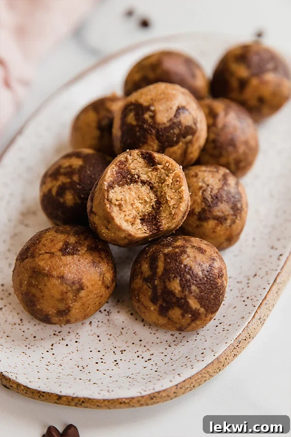 Chocolate swirl energy bites piled on a platter.