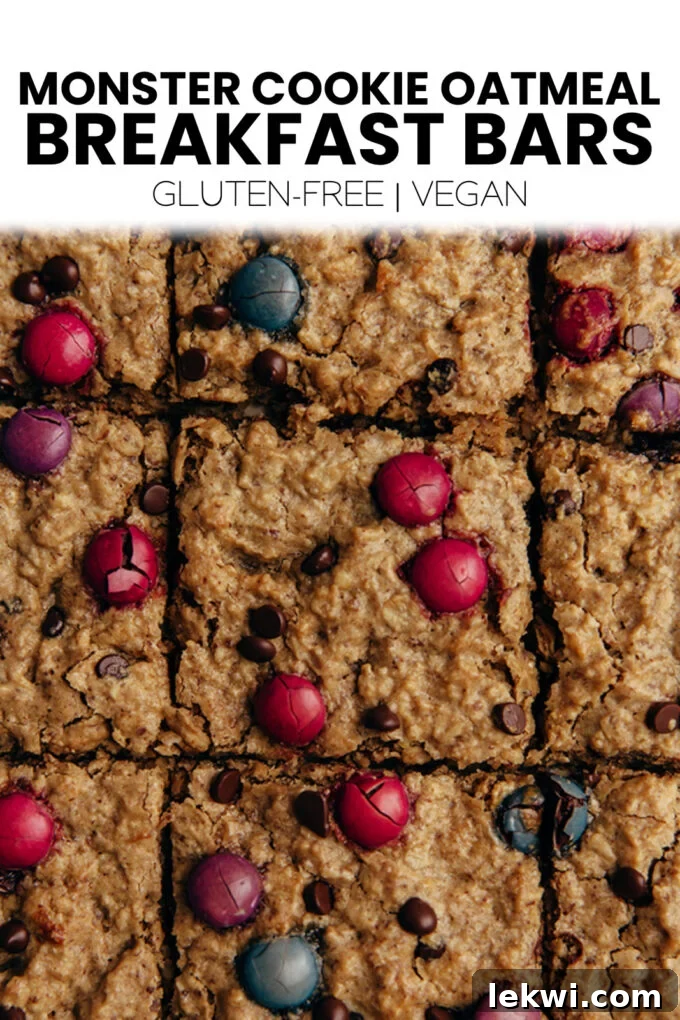 Large image of Monster Cookie Oatmeal Breakfast Bars with text overlay "Monster Cookie Oatmeal Breakfast Bars Gluten-Free | Vegan." highlighting key dietary benefits for social sharing.