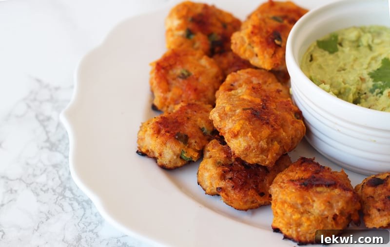 Sweet Potato Chicken Poppers (Paleo, AIP) on a plate with dipping sauce.