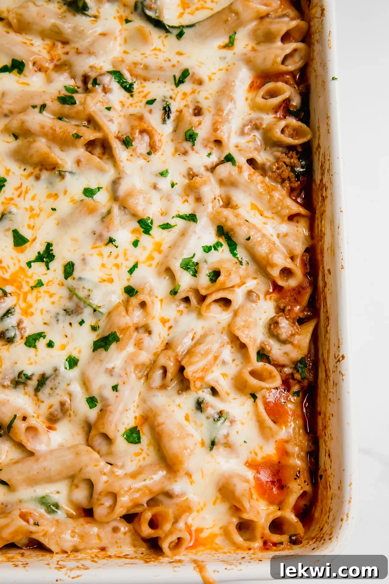 Hearty and delicious No-Boil Pasta Bake in a ceramic baking dish, ready to be served.