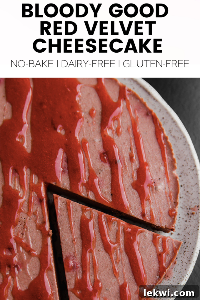 Cheesecake with text "Bloody Good Red Velvet Cheesecake No-Bake | Dairy-Free | Gluten-Free." This image shows the final presentation of the cheesecake.