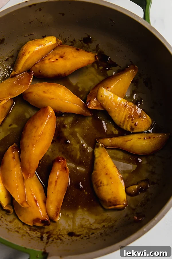 A pan with pears cooking.