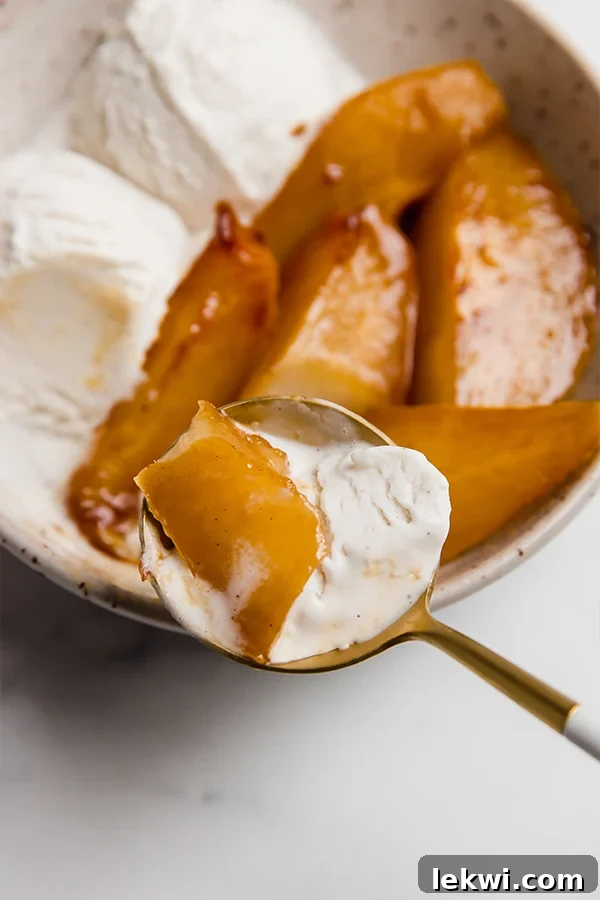 A bite of pear with ice cream.