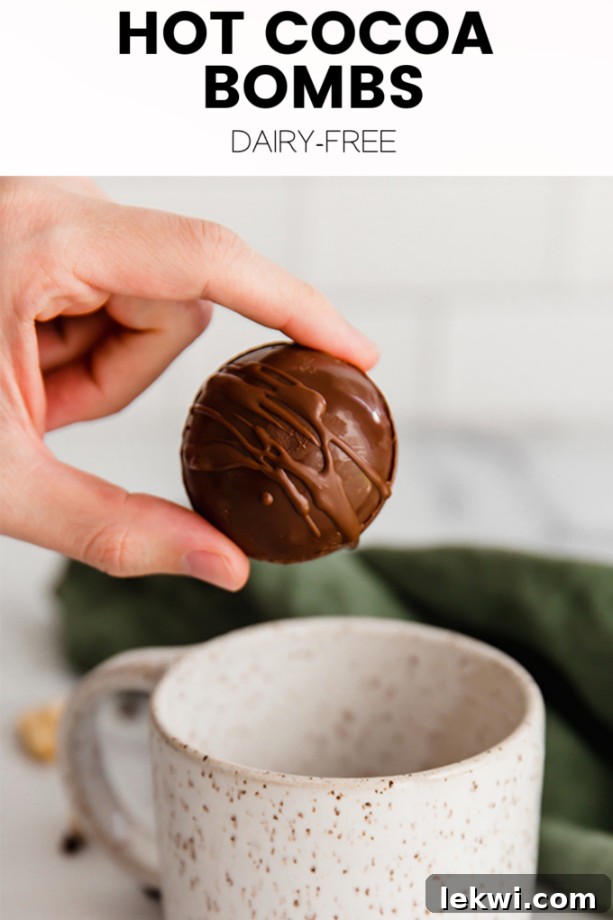 Person holding chocolate with text \"How Cocoa Bombs Dairy-Free.\"