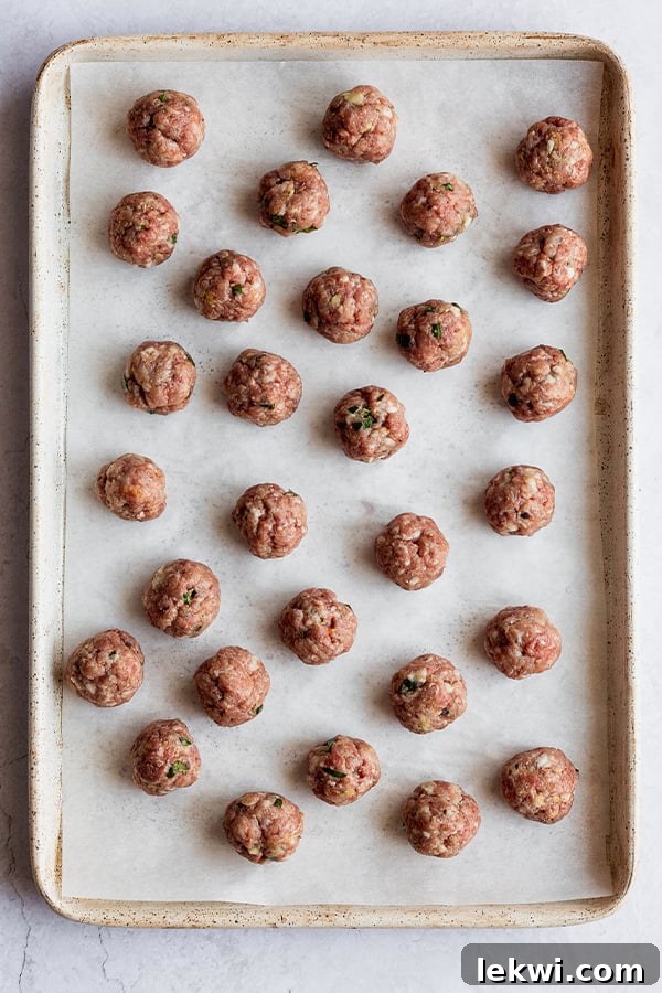 Meatballs on a baking sheet.