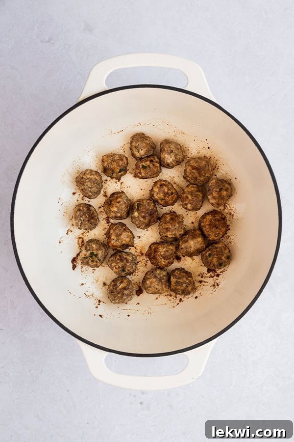 A dutch oven with meatballs.