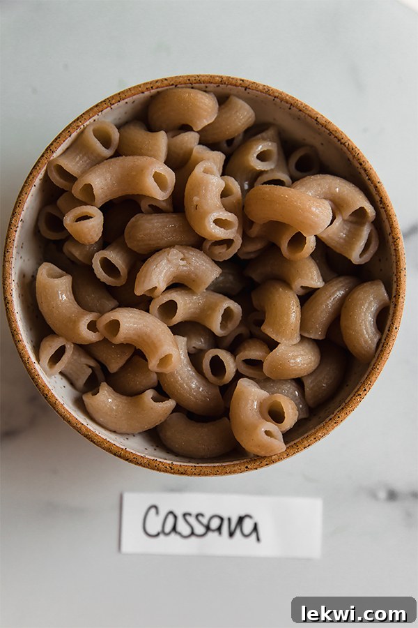 A bowl of cooked Jovial cassava pasta, showing its unique light color and smooth texture.