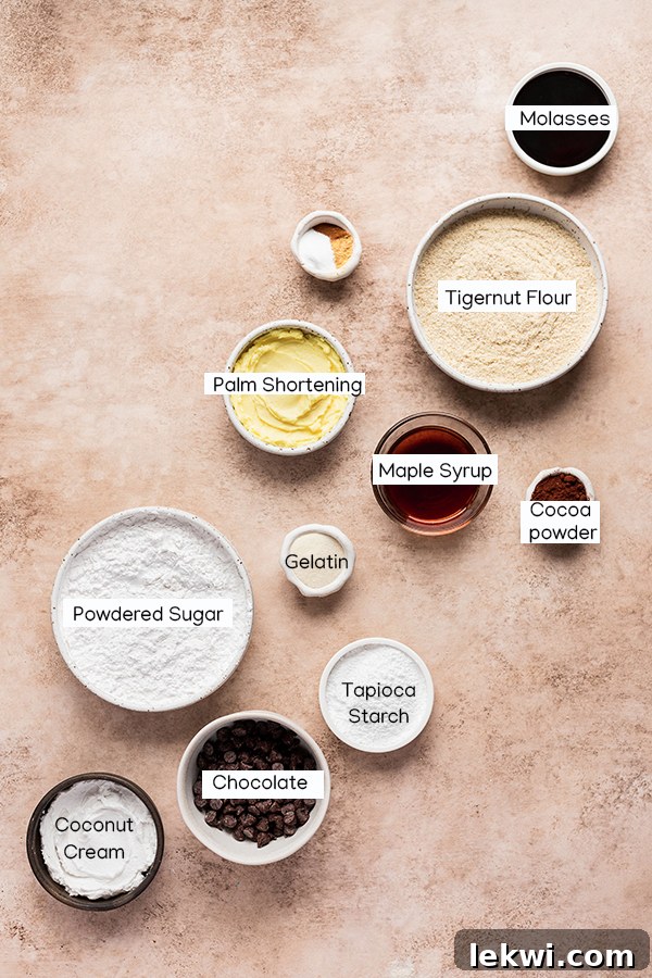 Various ingredients laid out for making chocolate gingerbread sandwich cookies, including flours, spices, and wet ingredients.