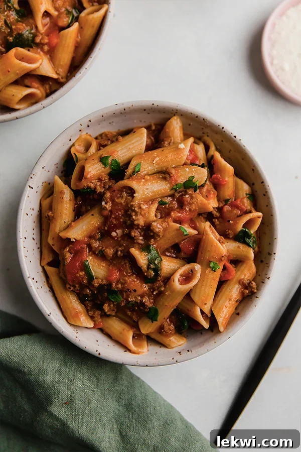 A beautifully presented bowl of Gluten-Free Instant Pot Pasta, showcasing its texture and rich sauce.