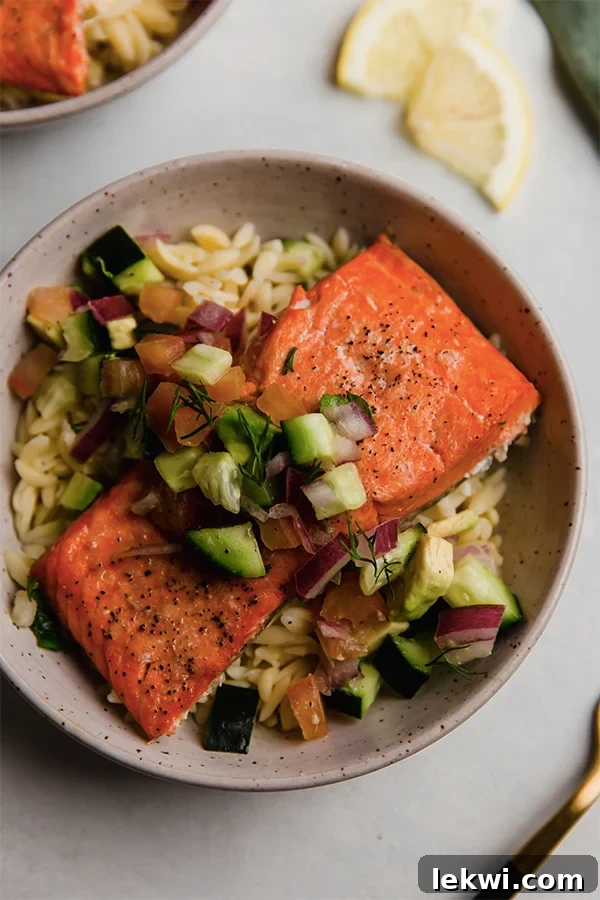 Salmon with Greek salsa over orzo.