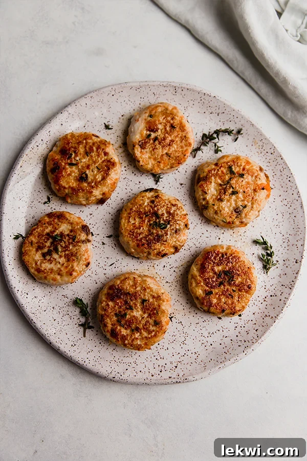 A vibrant plate filled with perfectly cooked turkey breakfast sausages, ready to be enjoyed.