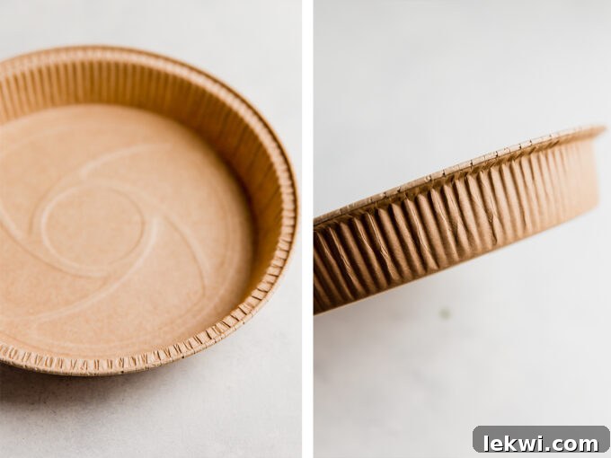 Several disposable aluminum pie pans, perfect for preparing and freezing multiple sweet potato shepherd's pie portions.