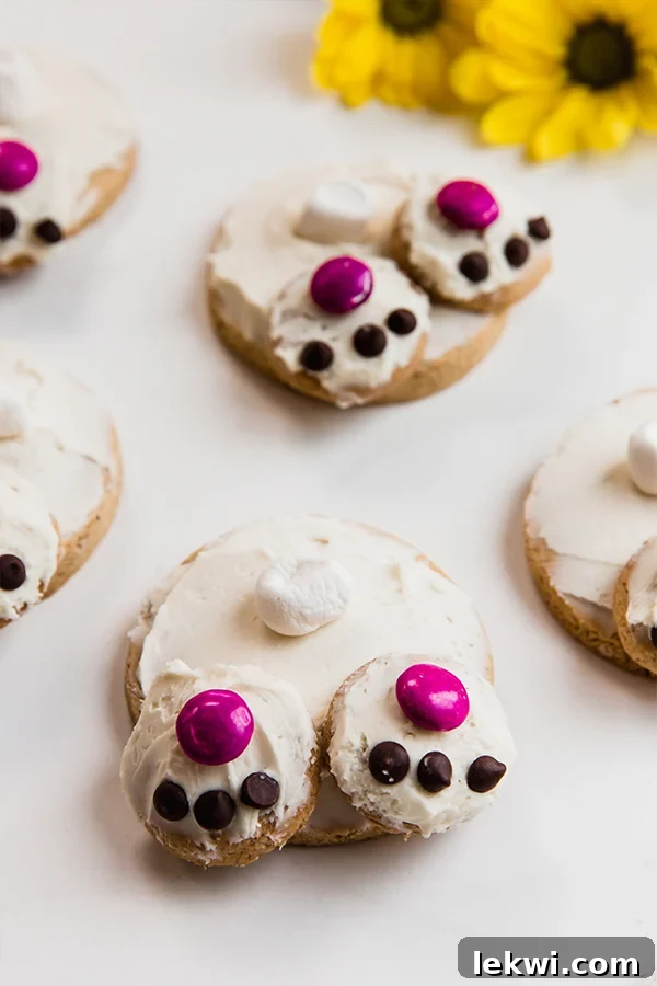 Several sugar cookies decorated to look like bunny bums.