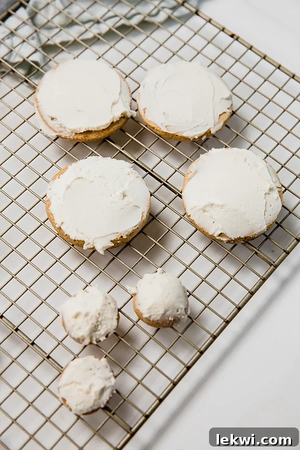 frosted cookies on a cooling rack