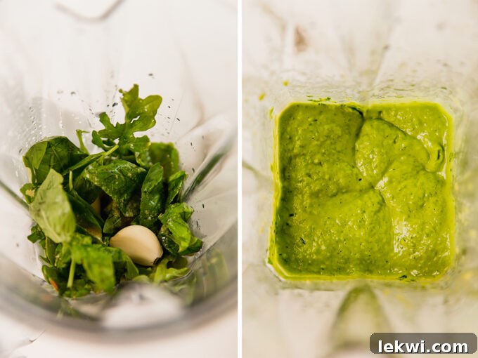 Close-up of fresh ingredients being blended in a food processor to create avocado pesto.