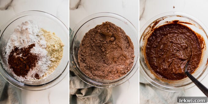 The process of combining dry and wet ingredients in separate glass bowls, then gently folding them together to create a smooth, consistent chocolate cake batter.