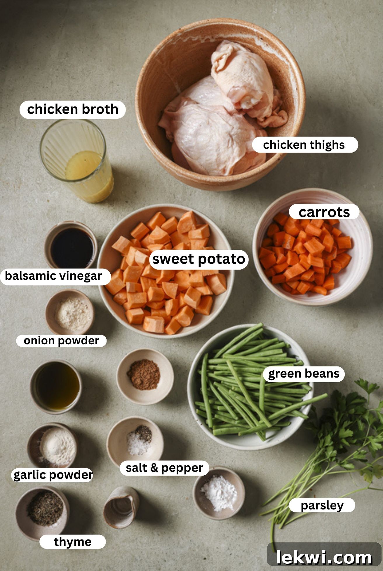 All fresh ingredients for slow cooker balsamic chicken and vegetables, neatly arranged in bowls.