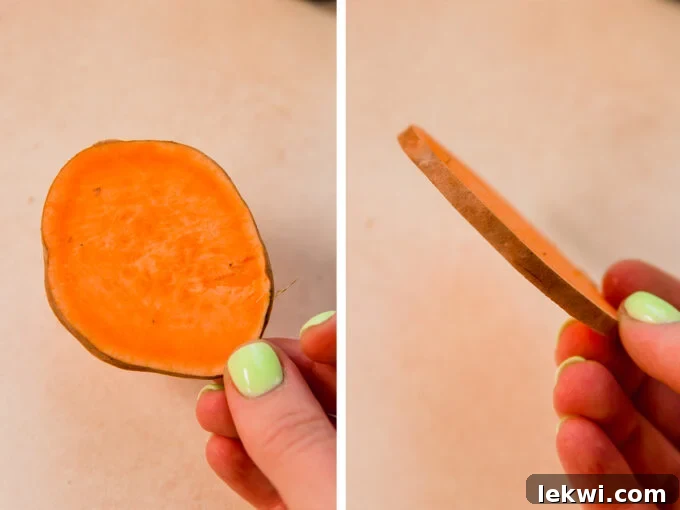 A perfectly sliced sweet potato round, ready to be seasoned and baked for sweet potato nachos.