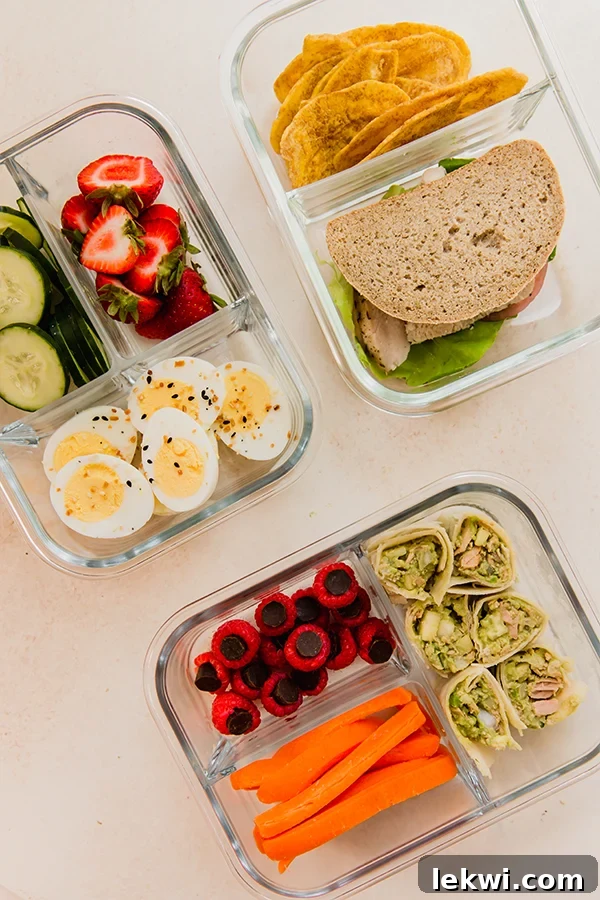 Three divided containers full of healthy adult lunchables, featuring a variety of wholesome foods.