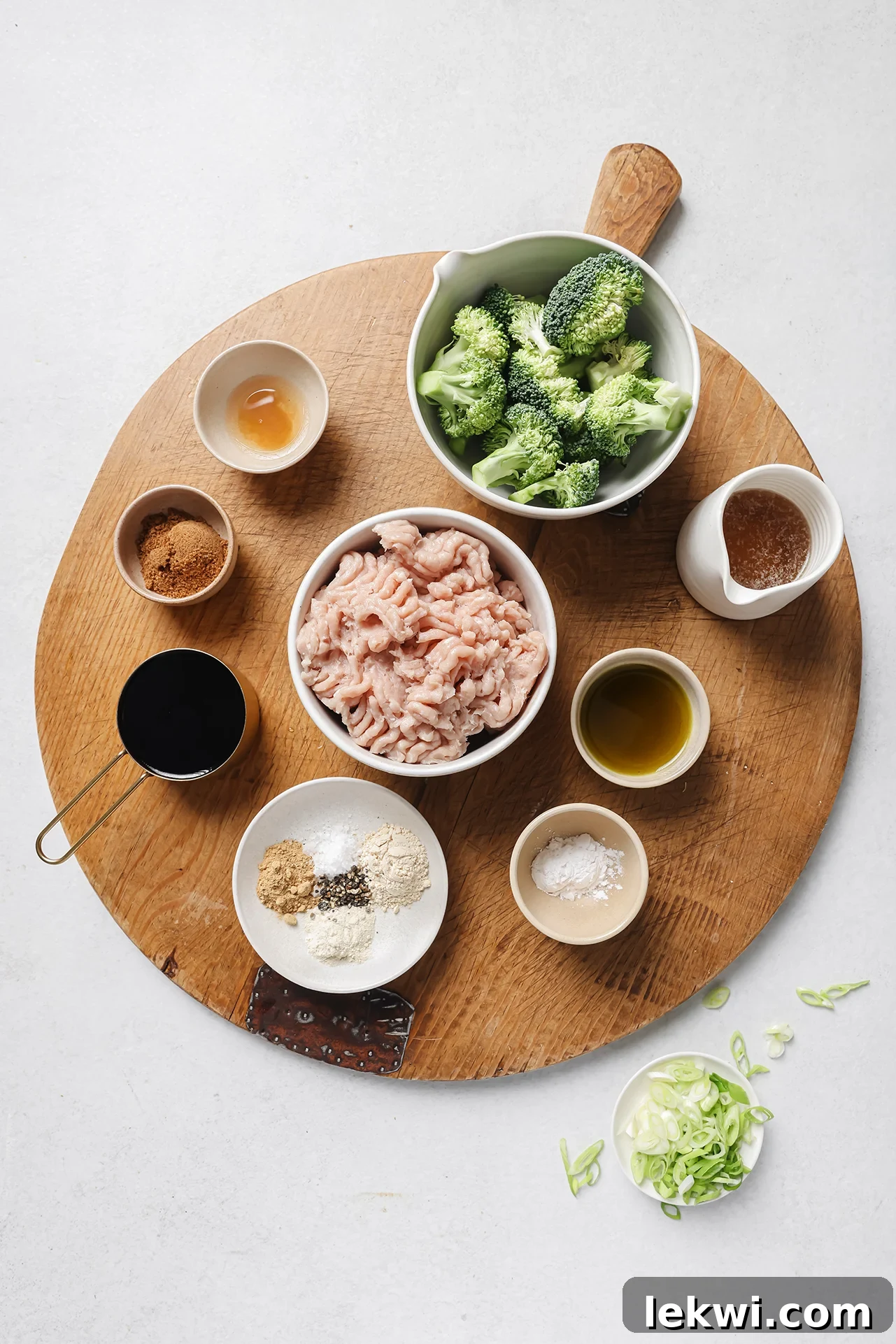 Ground chicken and broccoli ingredients in separate bowls.
