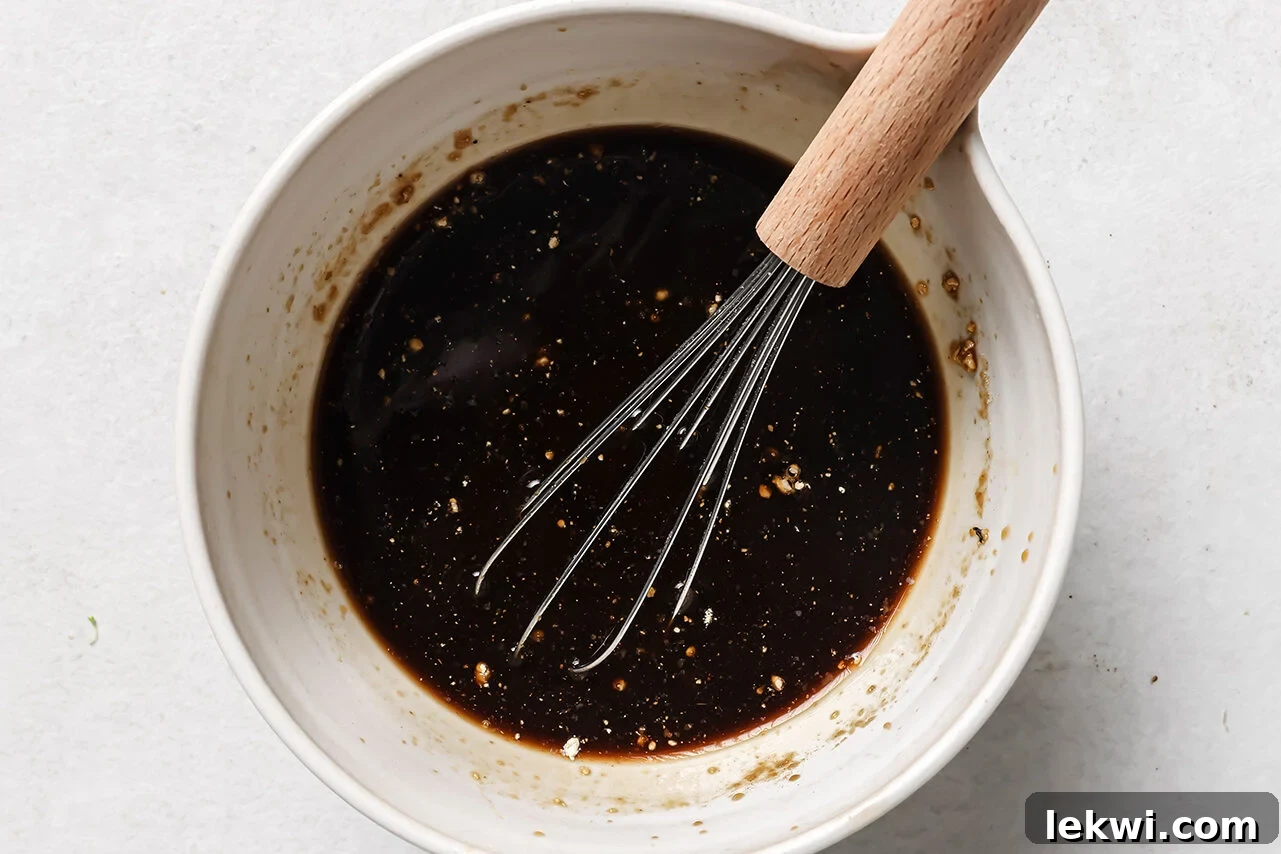 Teriyaki style sauce whisked together in a bowl.