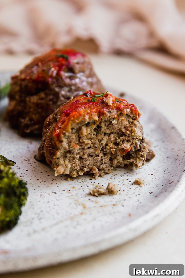 A meatloaf on a plate with a bite out of it.