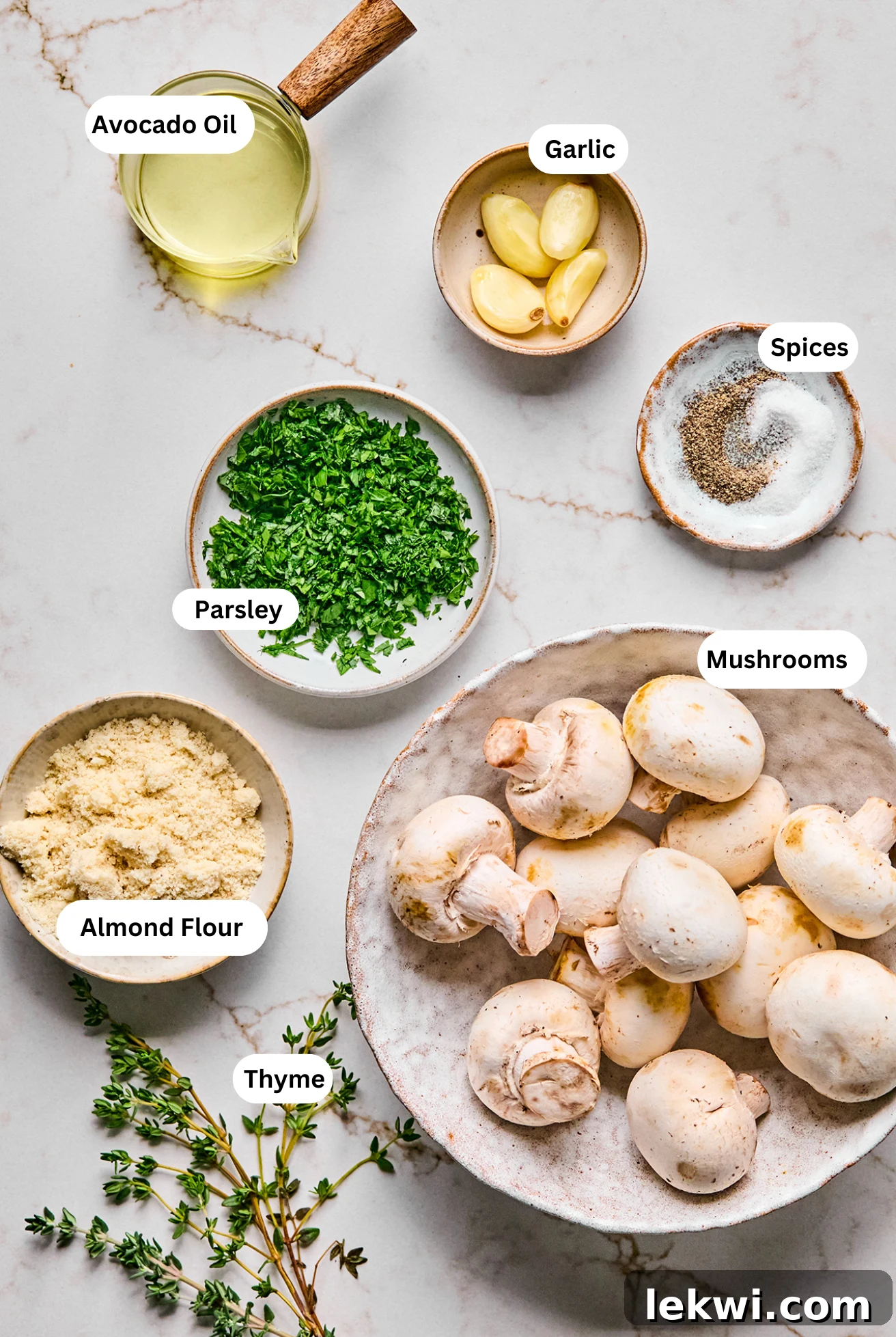 All the fresh and pantry ingredients laid out neatly, ready to make the delicious stuffed mushrooms.