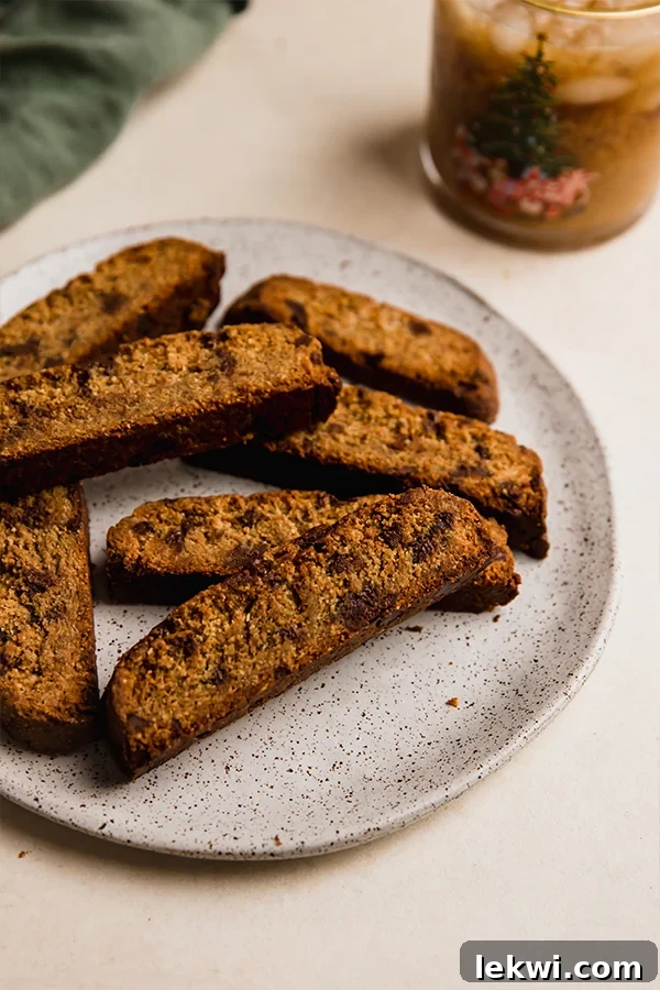 A plate brimming with golden-brown gluten-free chocolate chip biscotti, ready to be enjoyed.