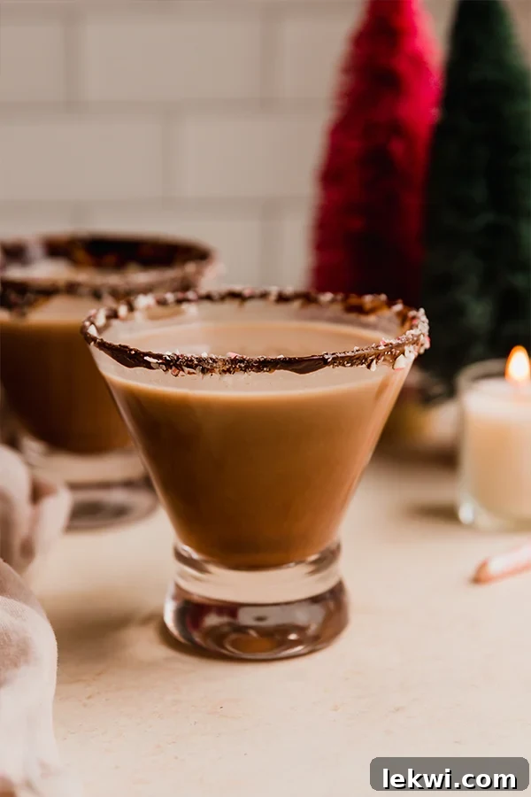Small glass of peppermint mocktail with a chocolate rim.