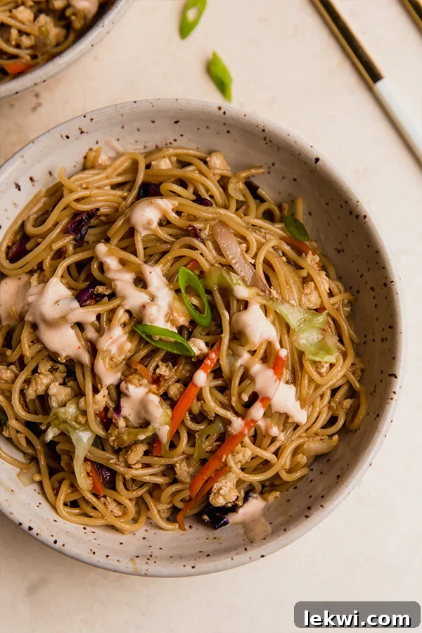 Egg roll ramen stir fry in a bowl.