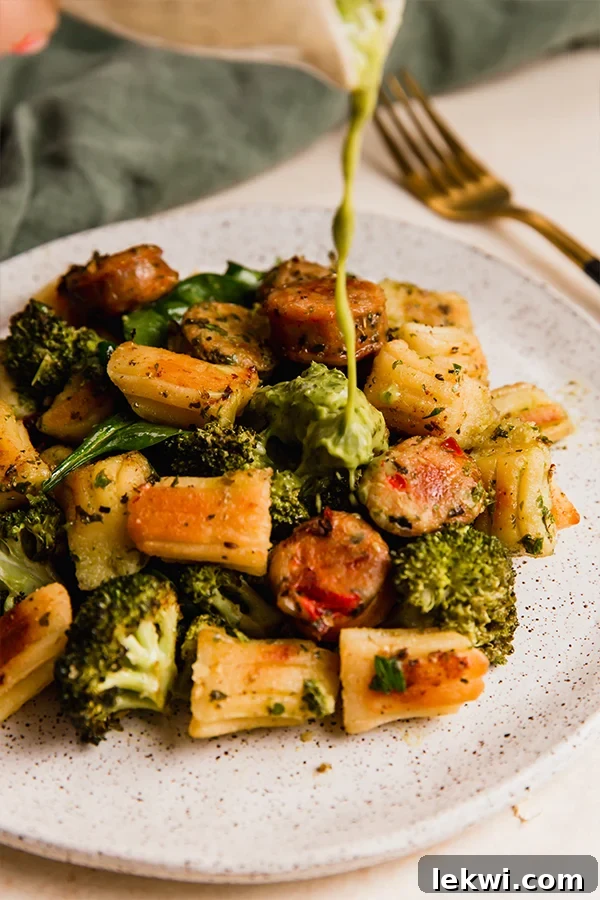 A plate featuring the delicious gnocchi & sausage sheet pan dinner, ready to be enjoyed.