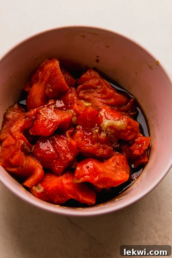 Salmon marinating in a garlic ginger sauce.