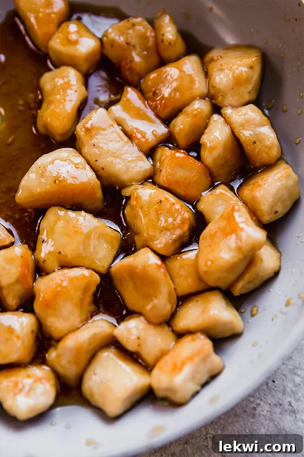 Honey butter chicken bites cooked in a pan.