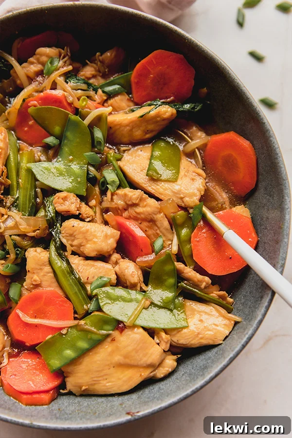 Dish of chop suey with a spoon.