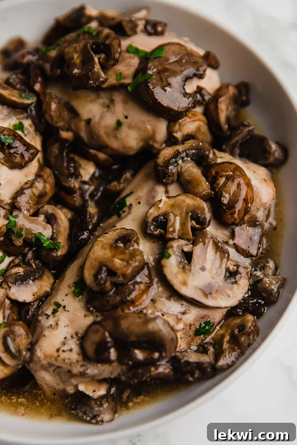 Bowl of chicken marsala with mushrooms.