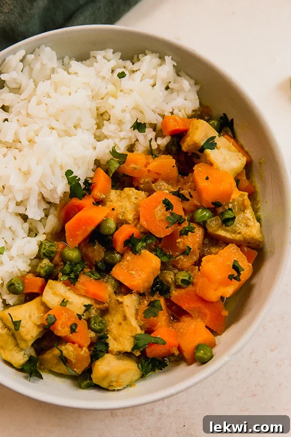 Turmeric chicken curry and rice in a bowl.