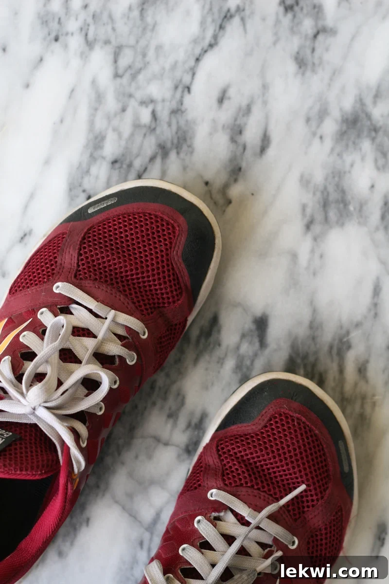 A person hiking through a forest, emphasizing daily movement and active lifestyle.